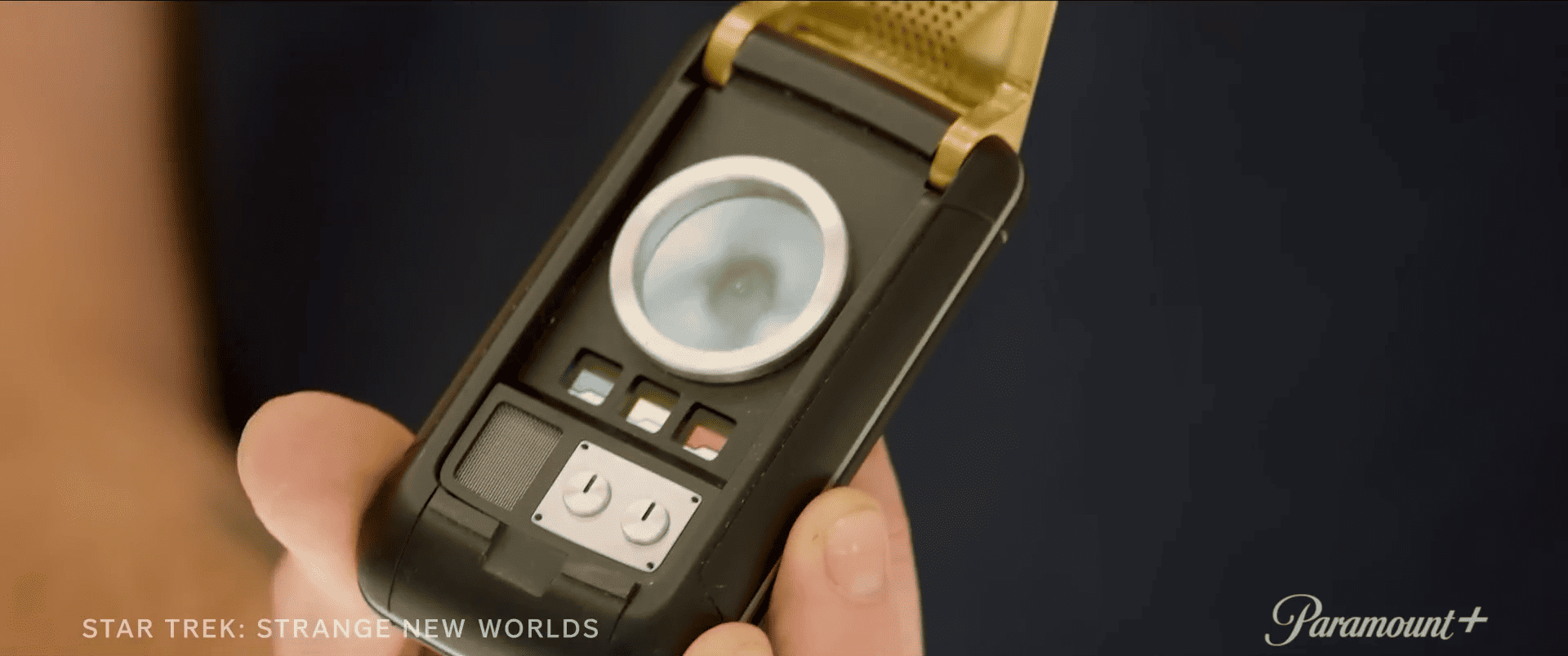  A handheld electronic device in this image from CBS Studios